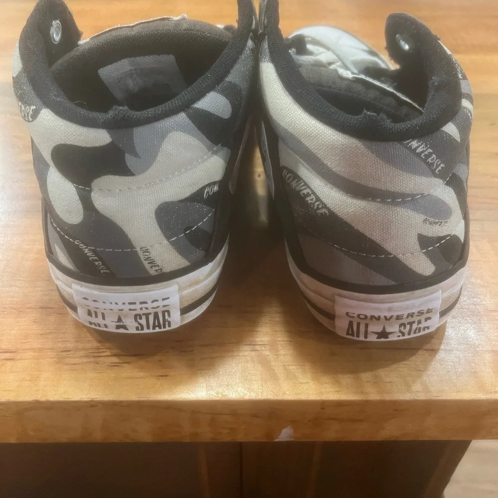 Converse Black and White High-Top Sneakers with Iconic Design